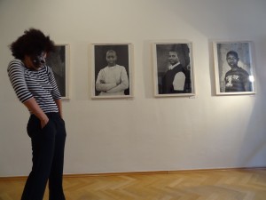 dancer oxana chi is dancing in front of the photographs of zanele muholi